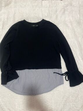 Black illusion top with bows and flare sleeves